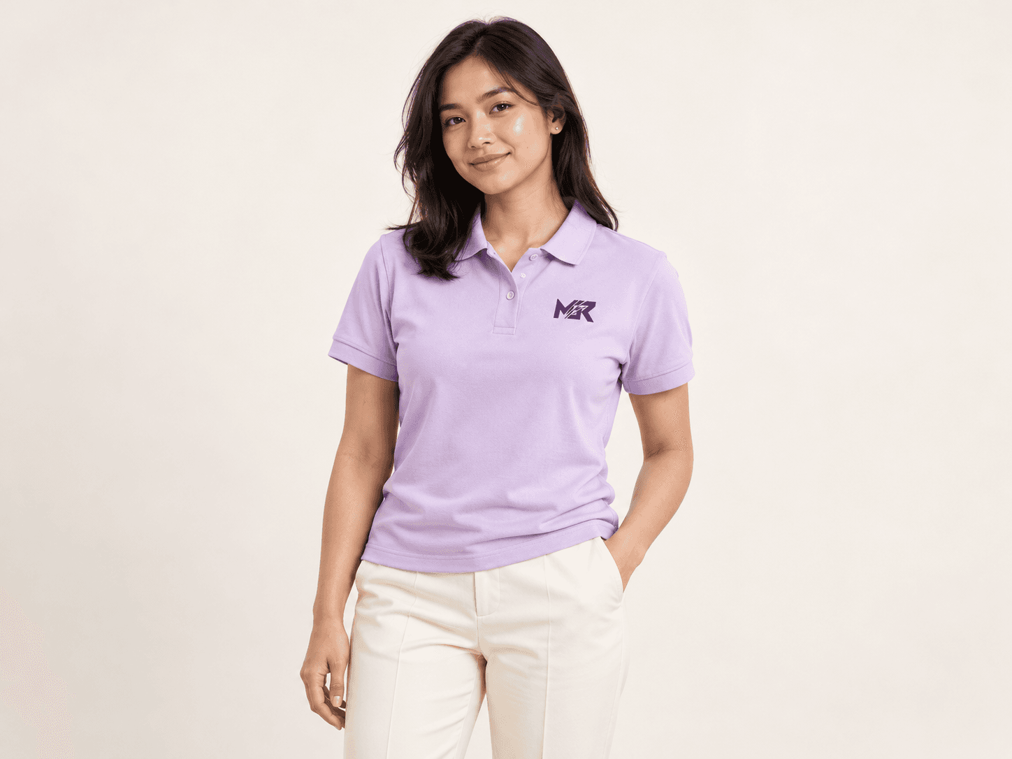 A studio portrait showcasing a pastel-lilac MGR company polo.